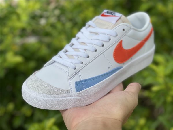 Nike Blazer Low 77 White Orange Lifestyle Shoes In Hand